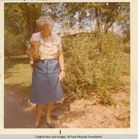 Elizabeth Burden holding Victoria the dog