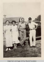Sandy and Ray standing by car