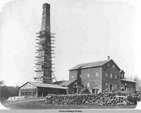 Workers repairing flour mill chimney, West Amana, Iowa, 1903