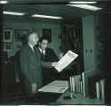 Library Director Ralph Ellsworth, left, and librarian Clyde Walton in Special Collections Dept., The University of Iowa, 1951