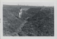 Man Stands in Gully.