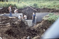 Installation of an aluminum drop spillway structure on the farm of Ken Carney.
