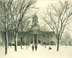 Pedestrians  walking in snow in front of Old Capitol, The University of Iowa, February 3, 1896