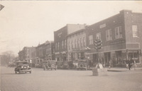 0116 South side of square looking east showing brick streets and some businesses in the 1920's