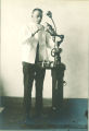 Dentist working with dental equipment, The University of Iowa, 1930s?