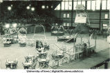 Field House set up with tables, decorations and booths with audience, The University of Iowa, 1923