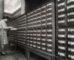 Woman at card catalog in upper rotunda lobby