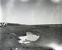 Water culvert surrounded by dirt that has been moved