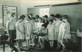 School girl giving demonstration for class, The University of Iowa, 1925