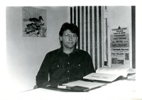 Man Seated at his Desk