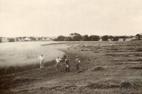 Four men Standing in Field