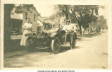 Woman and man posed by car, Iowa, 1910s