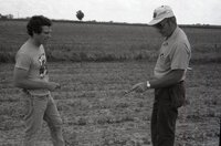 1978 Two men look at pipe