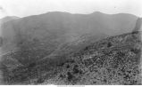 Crystalline rocks overlain by stratified clastic rocks on the mountains seem from the caverns beyond Ute Pass, Manitou, Colo., late 1890s or early 1900s