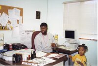 1999  District Conservationist J.B. Martin and his<br />
daughter, Jaria,  sit in his office