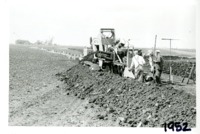 Art Salzman tiling machine on Wallace Riepe farm, 1952