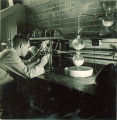 Man working on experiment in a lab, The University of Iowa, 1930s