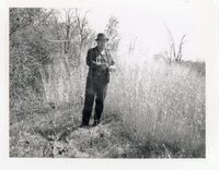 1970? John Maddy stands in switchgrass