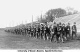 Governor's Day on Iowa Field, Cadets marching with rifles four abreast, The University of Iowa, May 12, 1917