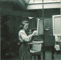 Art student painting, The University of Iowa, 1940
