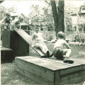 Children climbing on wood platforms and slides, The University of Iowa, May 28, 1941