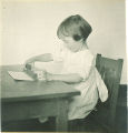 Girl playing with small blocks, The University of Iowa, ca. 1920