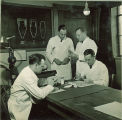Dental students working with models of teeth, The University of Iowa, 1940s