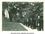 Commencement procession walking north along west side of Pentacrest, The University of Iowa, June 1930