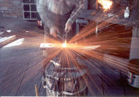 Roger Quaintance blacksmithing at Roger's Anvil, May 18, 1990