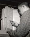 Student consulting the kardex for periodical information, 1962