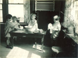 Small children washing and drying dishes, The University of Iowa, 1920s
