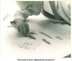 Professor Humbert Albrizio sculpting relief map for Navy pre-flight school, The University of Iowa, 1942-43