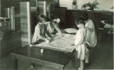Students making a quilt, The University of Iowa, May 19, 1932