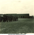 Soldiers marching outside football stadium, The University of Iowa, 1950s