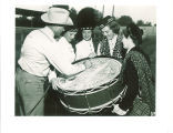 Man signing Scottish Highlanders drum, Colorado, September 14, 1953