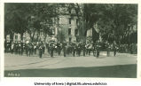 Marching band leading parade for Induction ceremony, The University of Iowa, 1920s