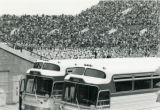 Charter busses and crowds at Homecoming football game, 1970