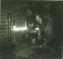 Man conducts electricity experiment, The University of Iowa, 1930s