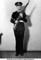 Gold medal marksman John G. Harrison of Dallas, Texas, posing with rifle, The University of Iowa, 1940