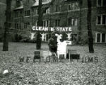 Stange House's lawn display, ""Clean K-State"", Homecoming, 1957