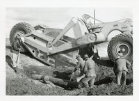 Earthmoving Scraper, Four Men and a Pipe