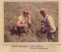 Dennis Rustman and Bill Welker Examine a Field.