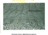 Marching band performing at football game, The University of Iowa, 1940s