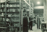 Men in a chemistry storage room, The University of Iowa, 1930s