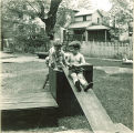 Children climbing on wood platforms and slides, The University of Iowa, May 28, 1941