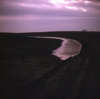 Broad based terrace with water. 