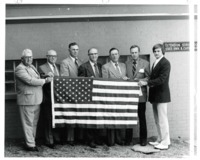 Group of Men holding the American Flag 