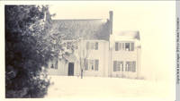 White house in winter with window open
