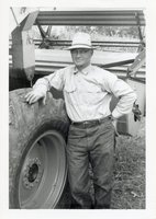 1964 - Clay Barnett Leans Against Tire