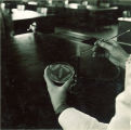 Using a petrie dish and a bunson burner, The University of Iowa, 1930s